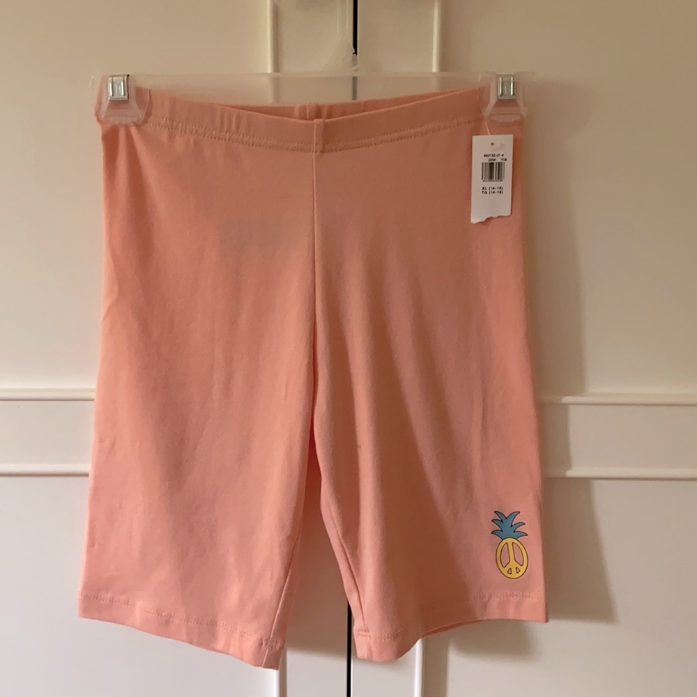 Peach coloured Biker shorts.